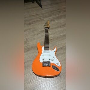 Mitchell TD100 Orange electric guitar. Cash only.